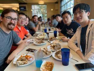 Male students enjoying a meal at the Dining Hall